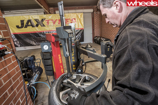 Mechanic -stripping -and -fitting -tyres -to -wheels