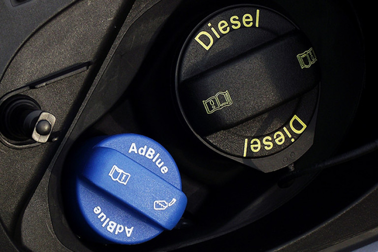 What is diesel exhaust fluid (AdBlue) and why is it used?
