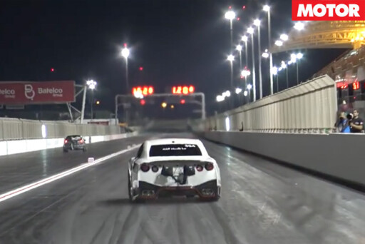 Nissan GT-R racing down drag strip