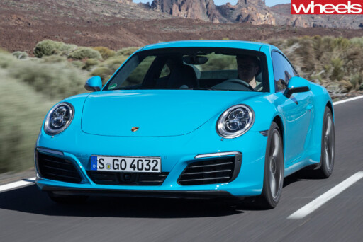 Porsche -911-Carerra -front -side -driving -road