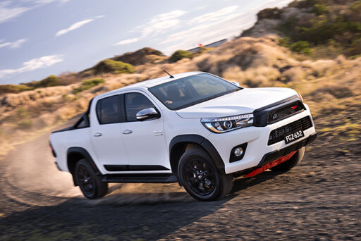 TRD Toyota Hilux white driving
