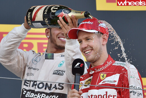 Lewis -Hamilton -pours -champagne -over -Ferrari -rival