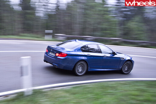BMW-M5-driving -in -Germany -driving -rear -side