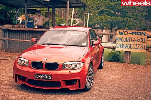 2013-BMW-1M-Coupe -parked -outside -cafe