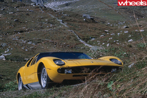 Yellow -Lamborghini -Muira -front -driving -up -hill