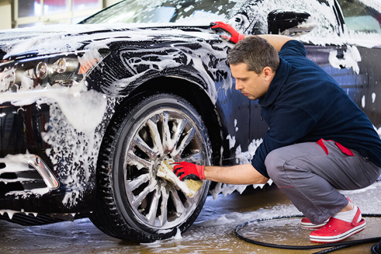 man washing car