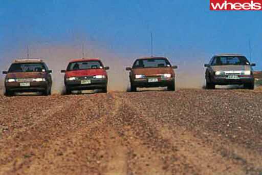 1988-Ford -Falcon -EA-26-vs -Holden -Commodore -VN-driving -sand