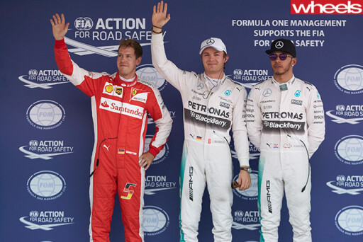 Hamilton -standing -on -podium -with -sunglasses