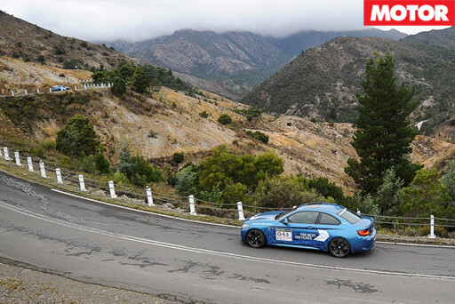 BMW M2 driving along mountains
