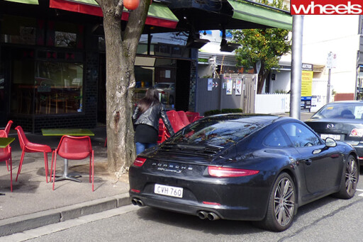 Porsche -911-rear -in -front -of -cafe-
