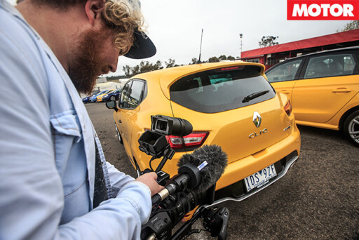 Camera guy filming cars