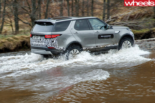 2017-Land -Rover -Discovery -prototype -wading -side -rear