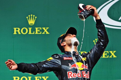 Daniel Ricciardo takes a shoey on the podium at the German Grand Prix