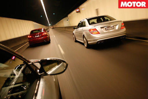 3 cars driving through tunnel
