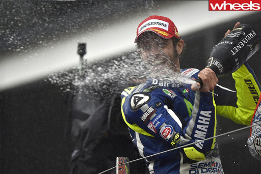 Valentino -Rossi -celebrates -Moto GP-win -with -champagne